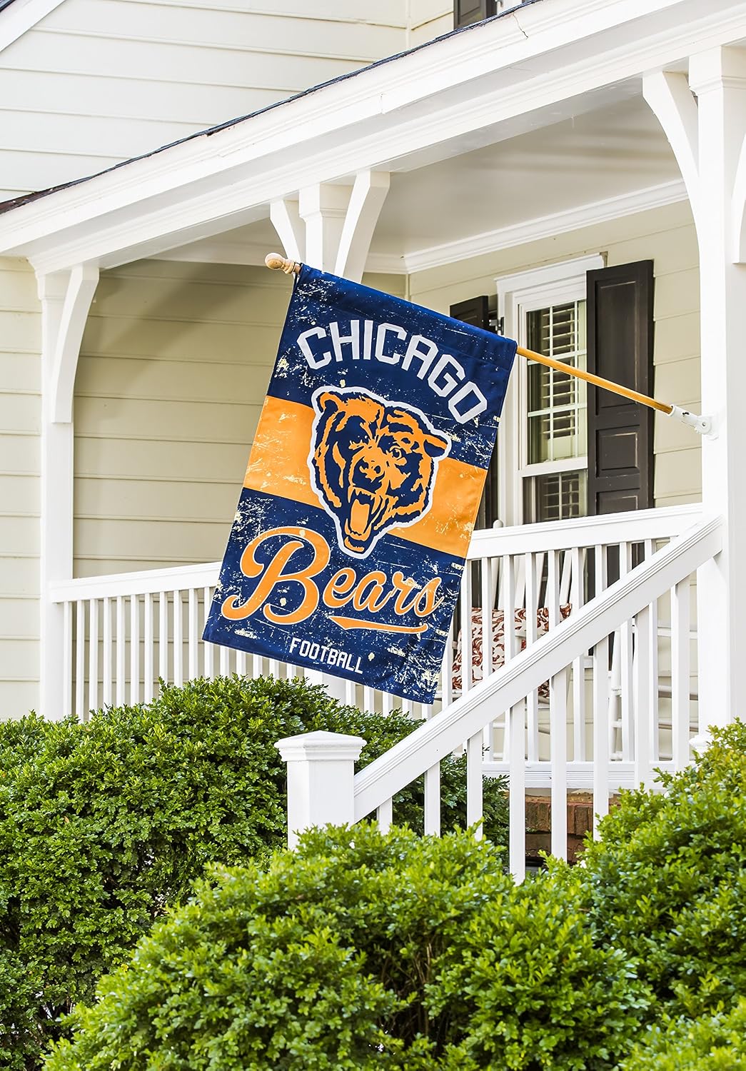 Chicago Bears 28x44 house flag hanging from a pole beside a front porch