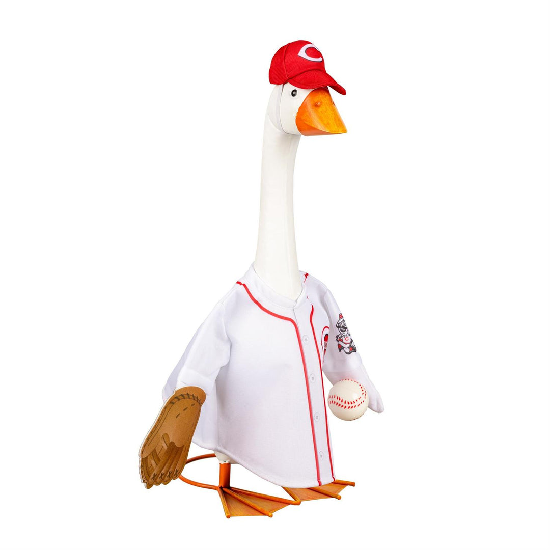 Porch goose modeling Cincinnati Reds jersey and red cap beside potted plants