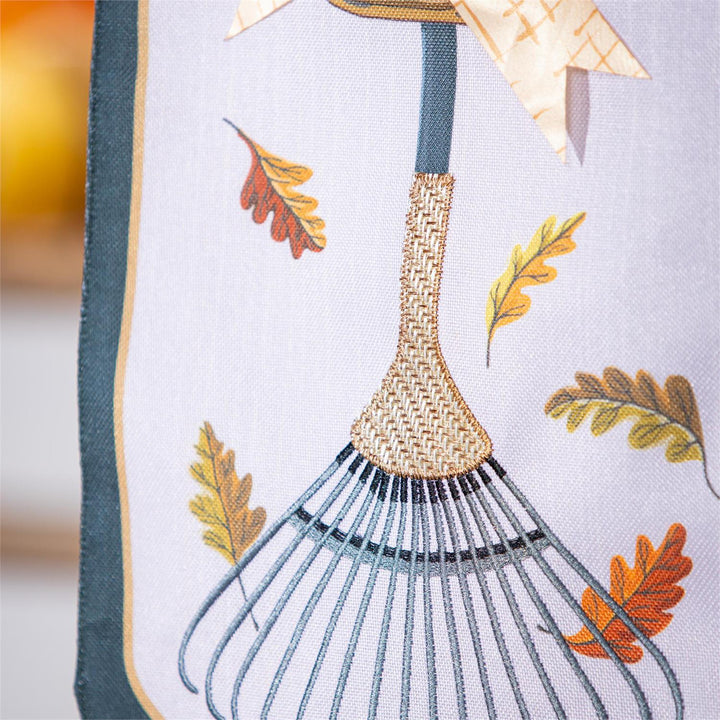 Fall Garden Rake and Mums Garden Flag close up detail of rake handle and oak leaves