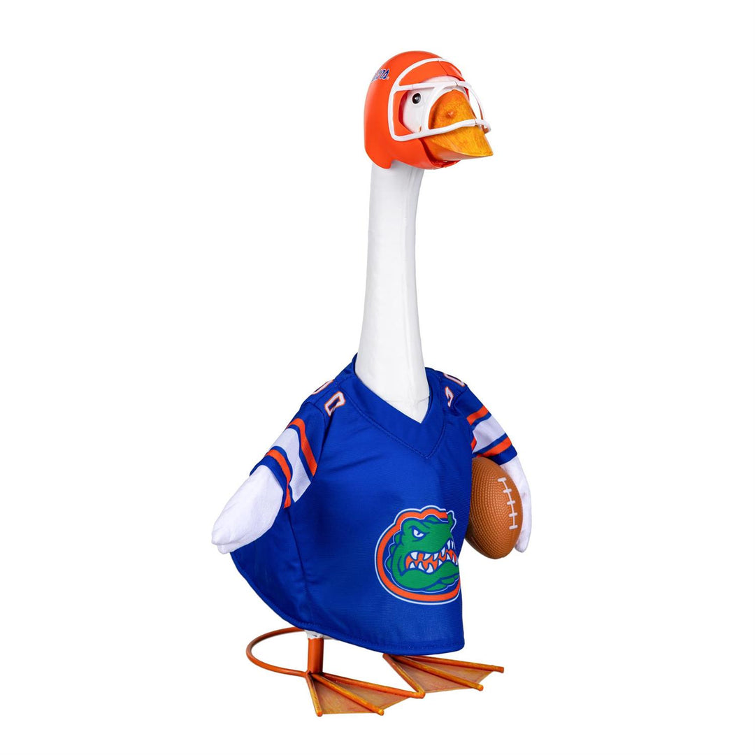 Side view of Florida Gators blue football jersey and orange helmet on a decorative goose; goose not included