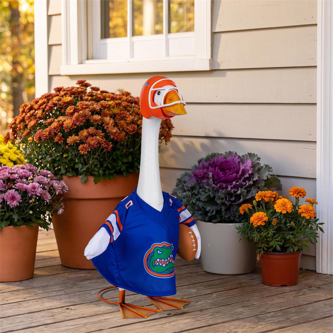 Florida Gators football outfit on a decorative goose beside porch flowers; 21-inch goose not included