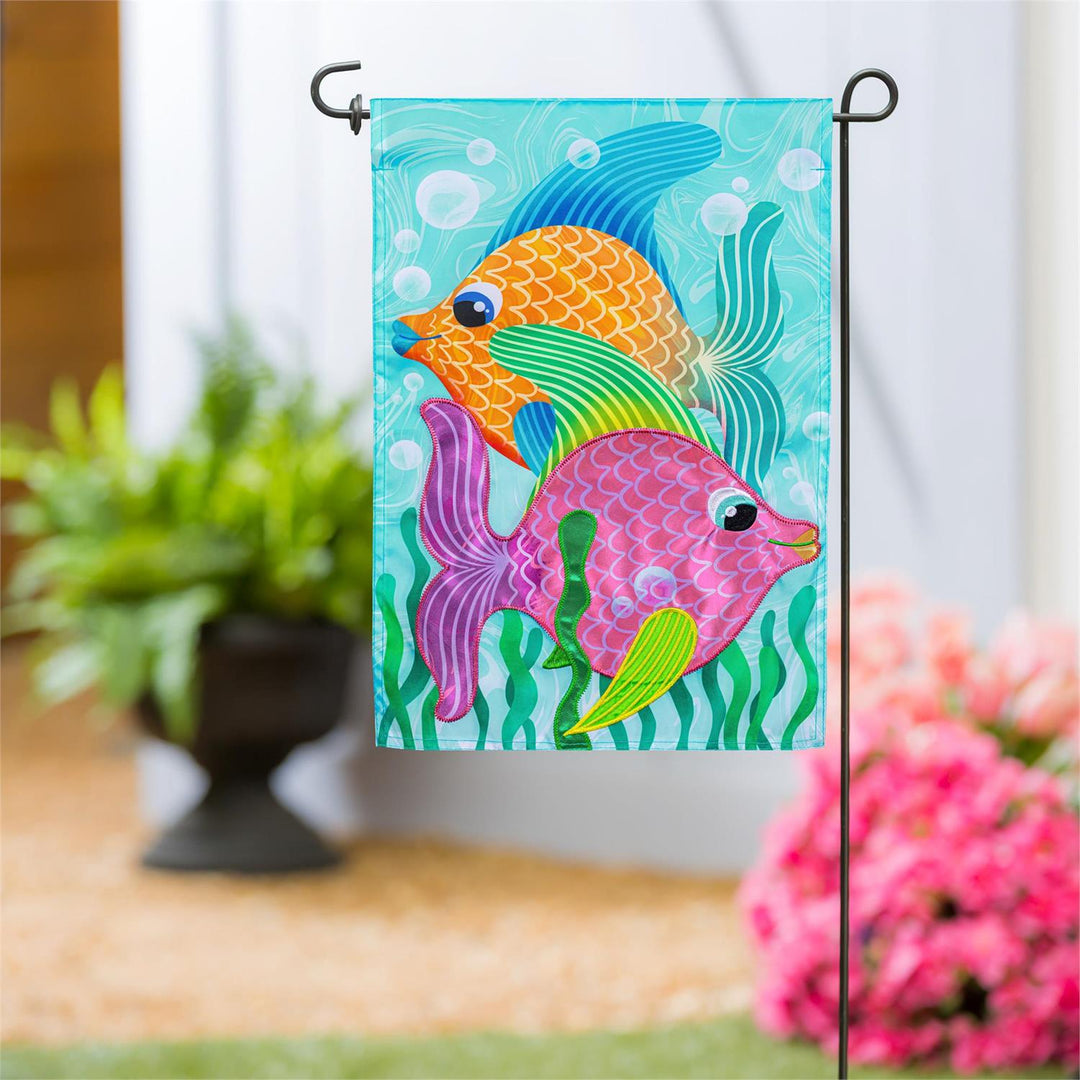 Funky Tropical Fish Garden Flag displayed on a garden flag pole outside a home entrance