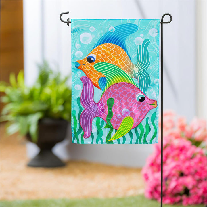Funky Tropical Fish Garden Flag displayed on a garden flag pole outside a home entrance