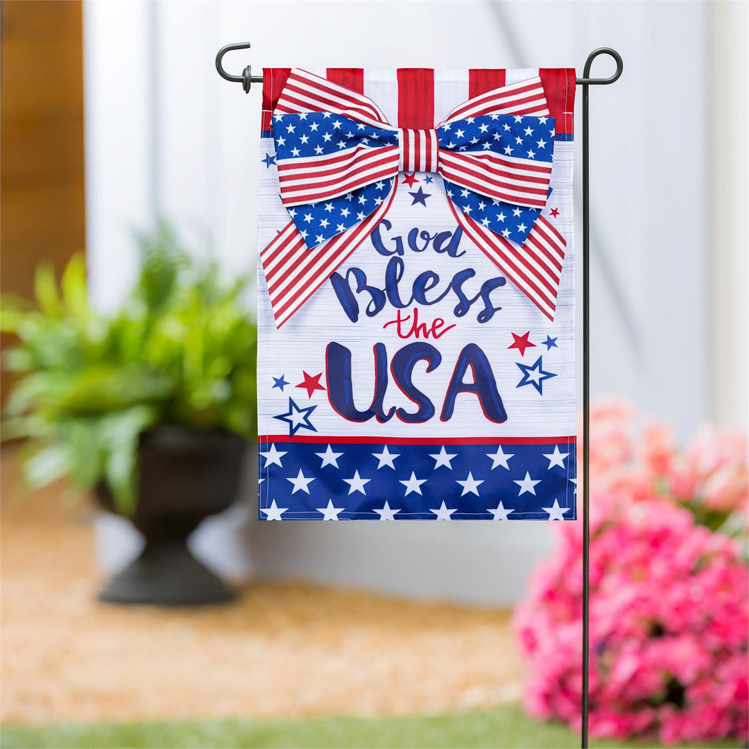 God Bless The USA Bow Garden Flag displayed on a garden flag pole outside a home entrance
