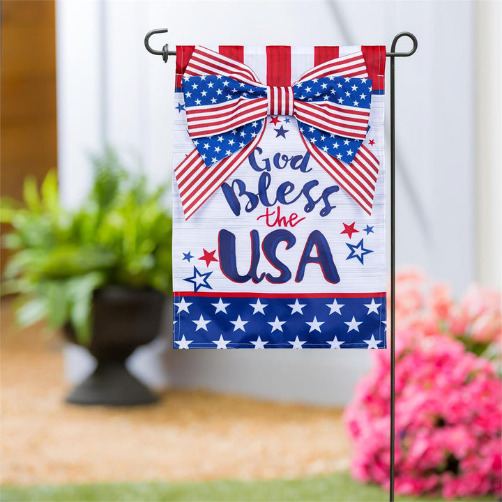 God Bless The USA Bow Garden Flag displayed on a garden flag pole outside a home entrance