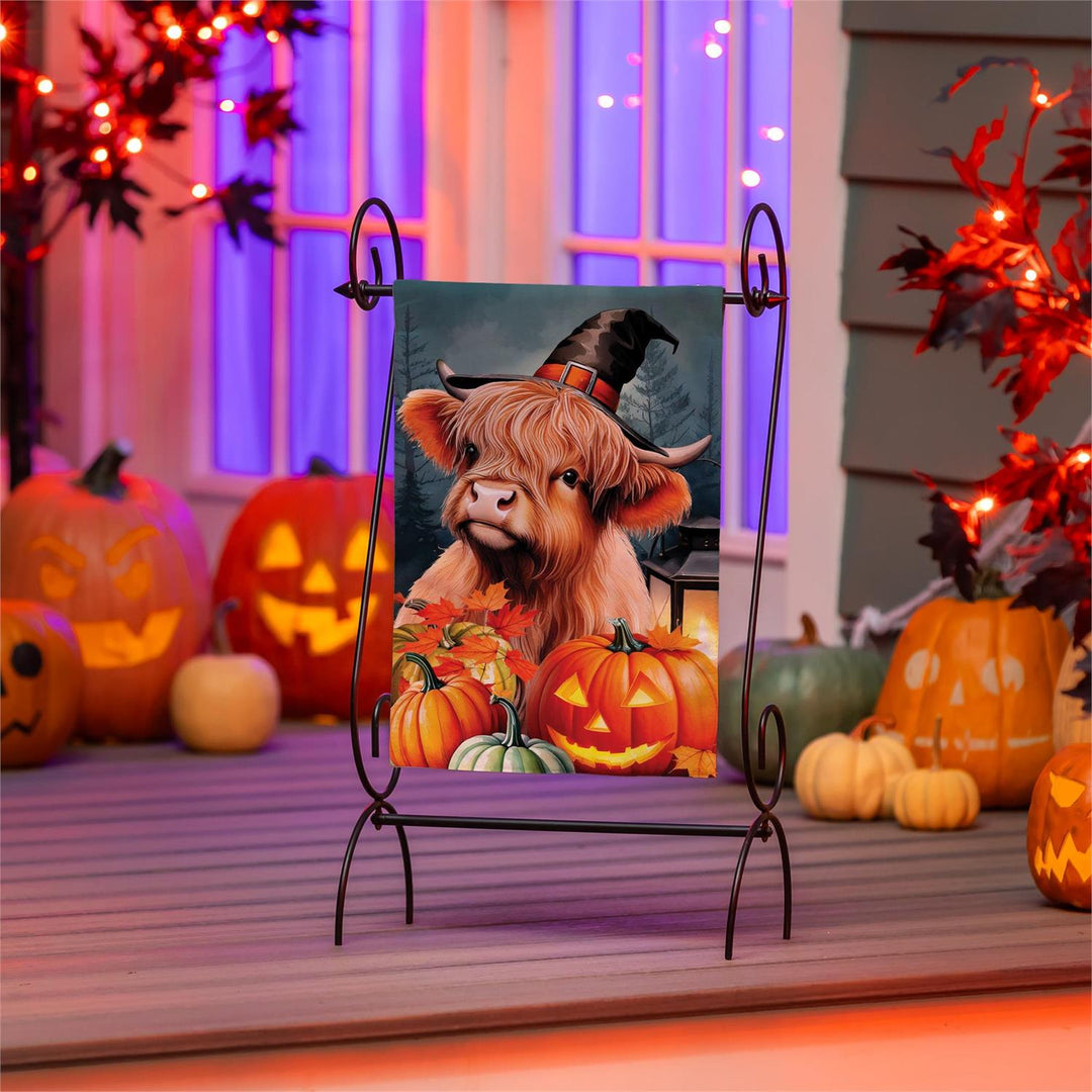 Highland Cow Halloween garden flag in a porch display