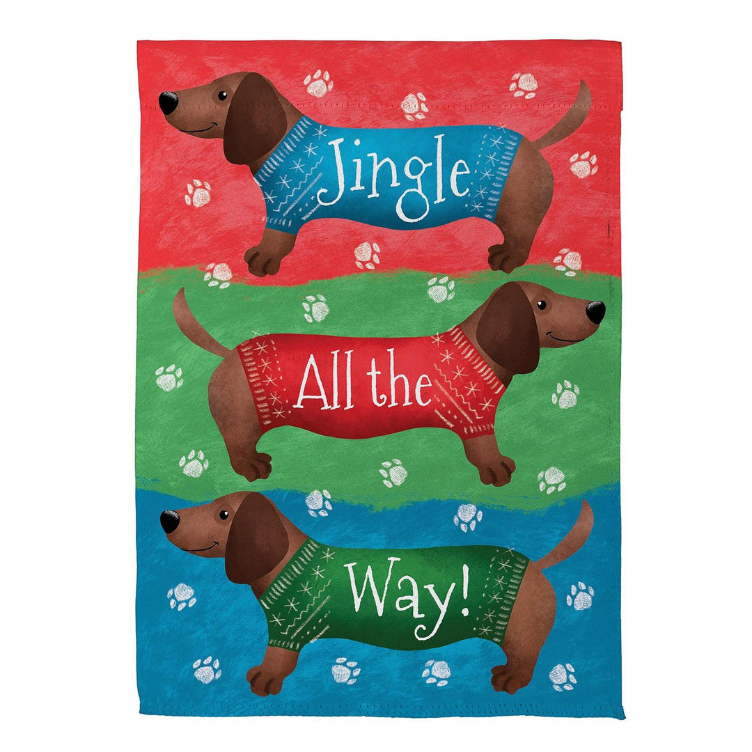 Jingle All the Way garden flag with three dachshunds in festive sweaters and paw prints