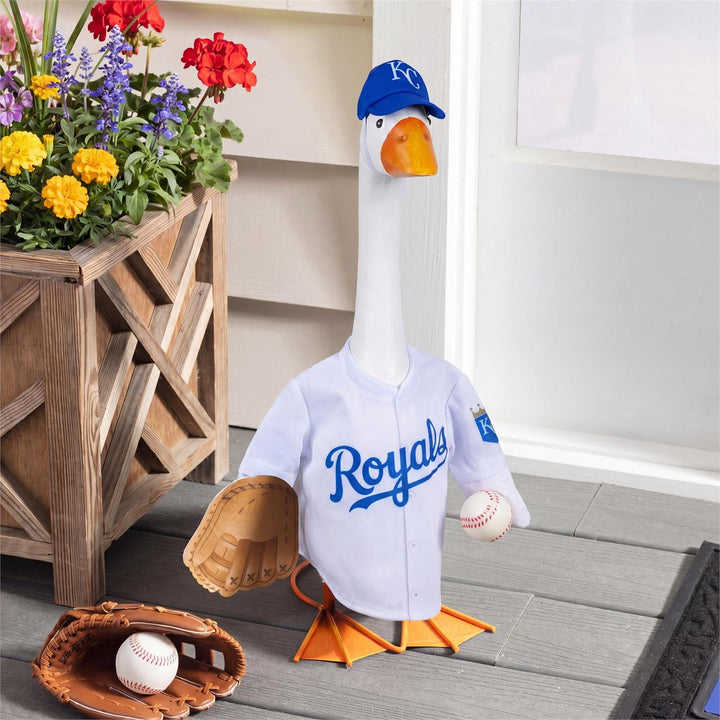 Rear view of porch goose modeling Royals jersey with outlined blue 01 and striped sleeves