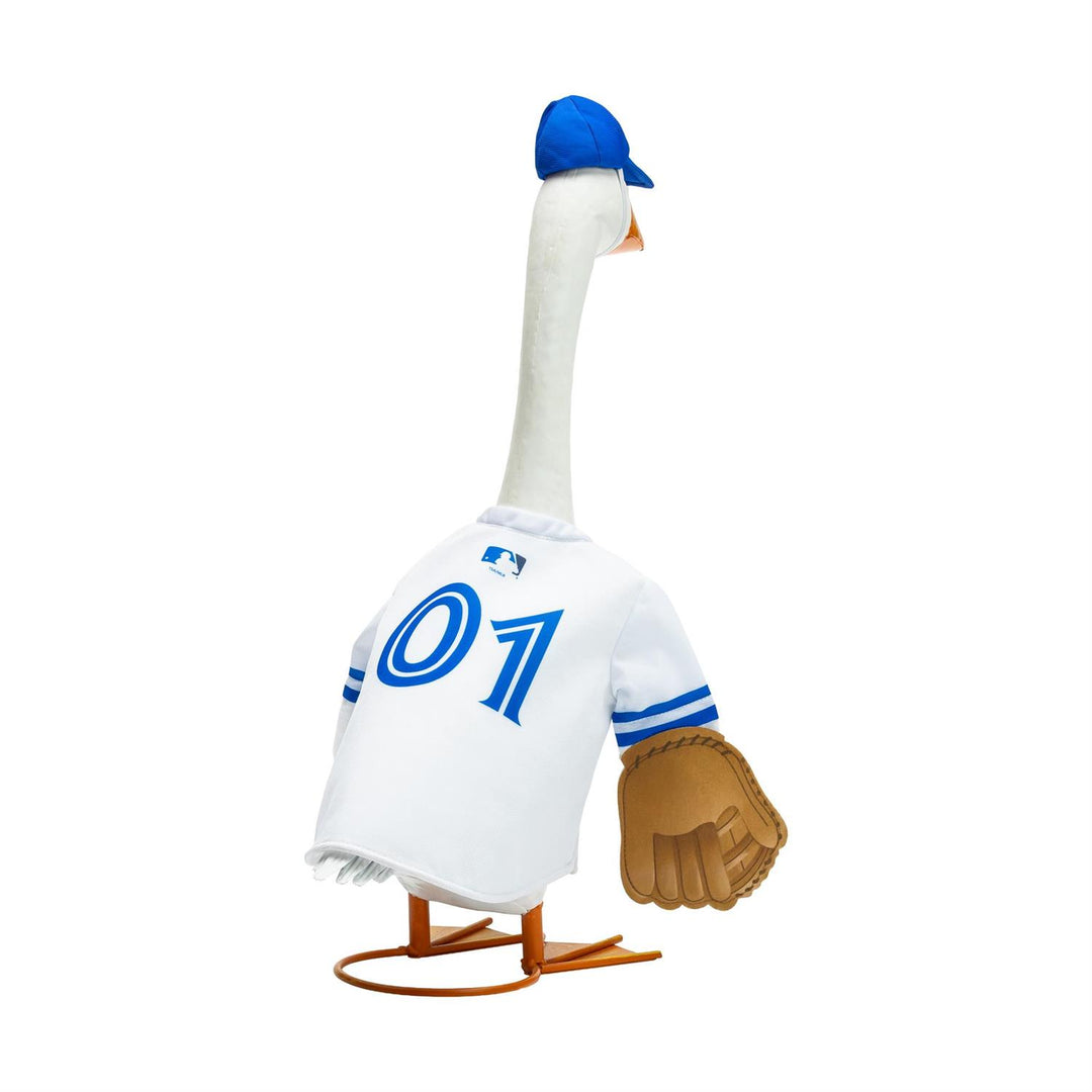 Porch goose modeling Kansas City Royals outfit beside a flower planter