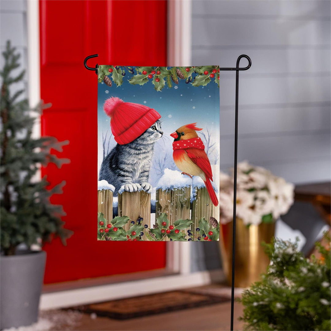 Kitten and cardinal winter garden flag on stand by red front door