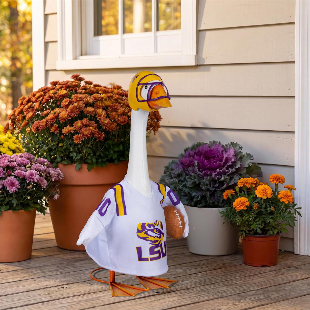 LSU Tigers football outfit displayed on a decorative goose beside porch flowers; 21-inch goose not included