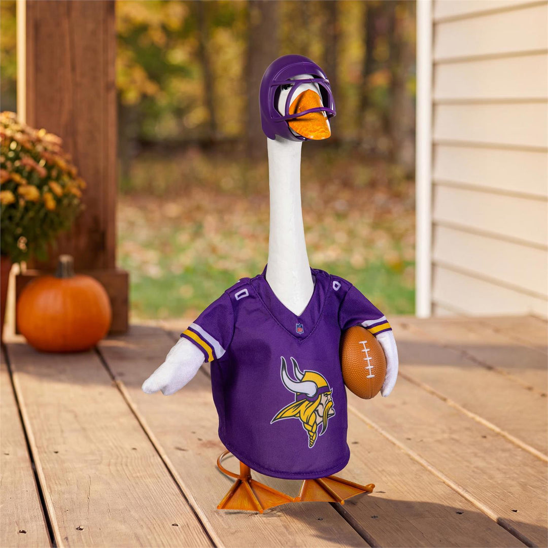 Porch goose modeling Minnesota Vikings jersey and helmet on a fall porch