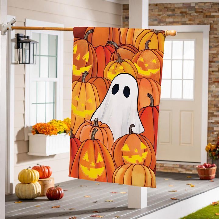 Halloween ghost and pumpkin banner hanging beside a porch entrance