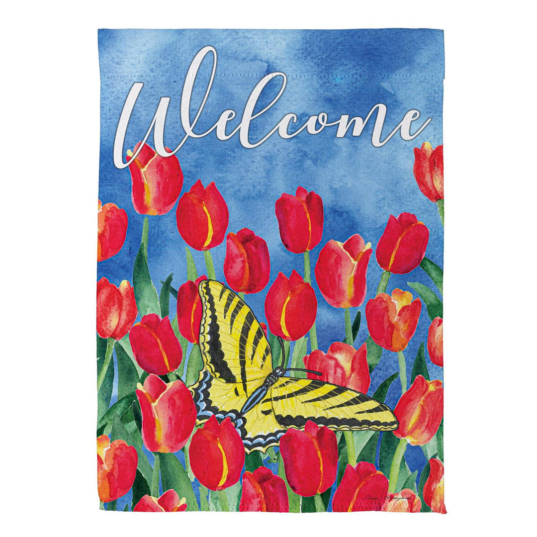 Floral Welcome garden flag displayed beside purple flowers in a decorative black frame; stand sold separately