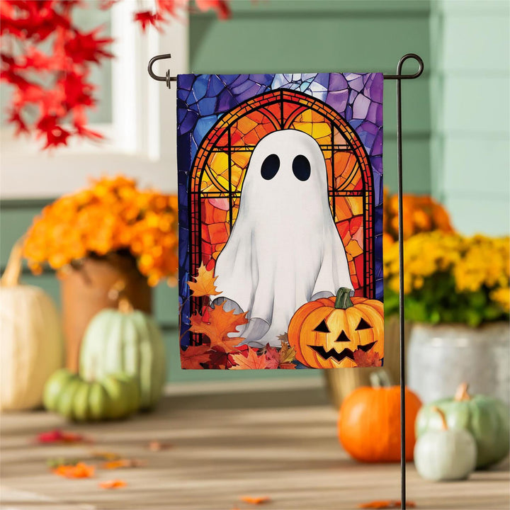 Close-up of ghost and orange stained-glass-style artwork on textured polyester burlap