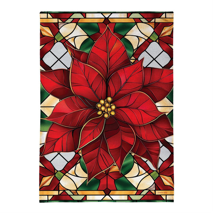Stained Glass Poinsettia garden flag displayed on a winter porch beside greenery and a sled