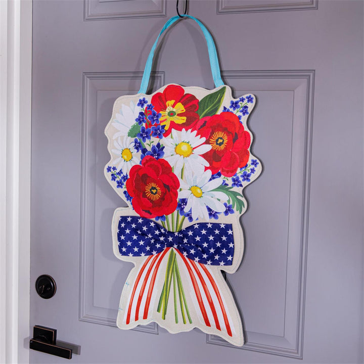 Summer Daisy Bow Bouquet Door Decor - patriotic side displayed hanging on a grey front door