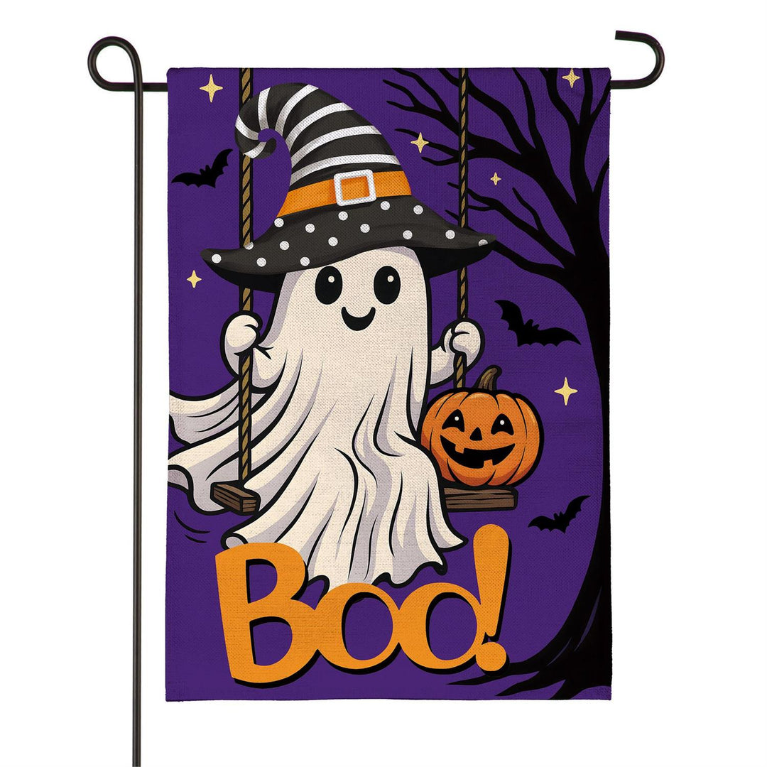 Close-up of textured burlap-style fabric and smiling ghost wearing a striped witch hat