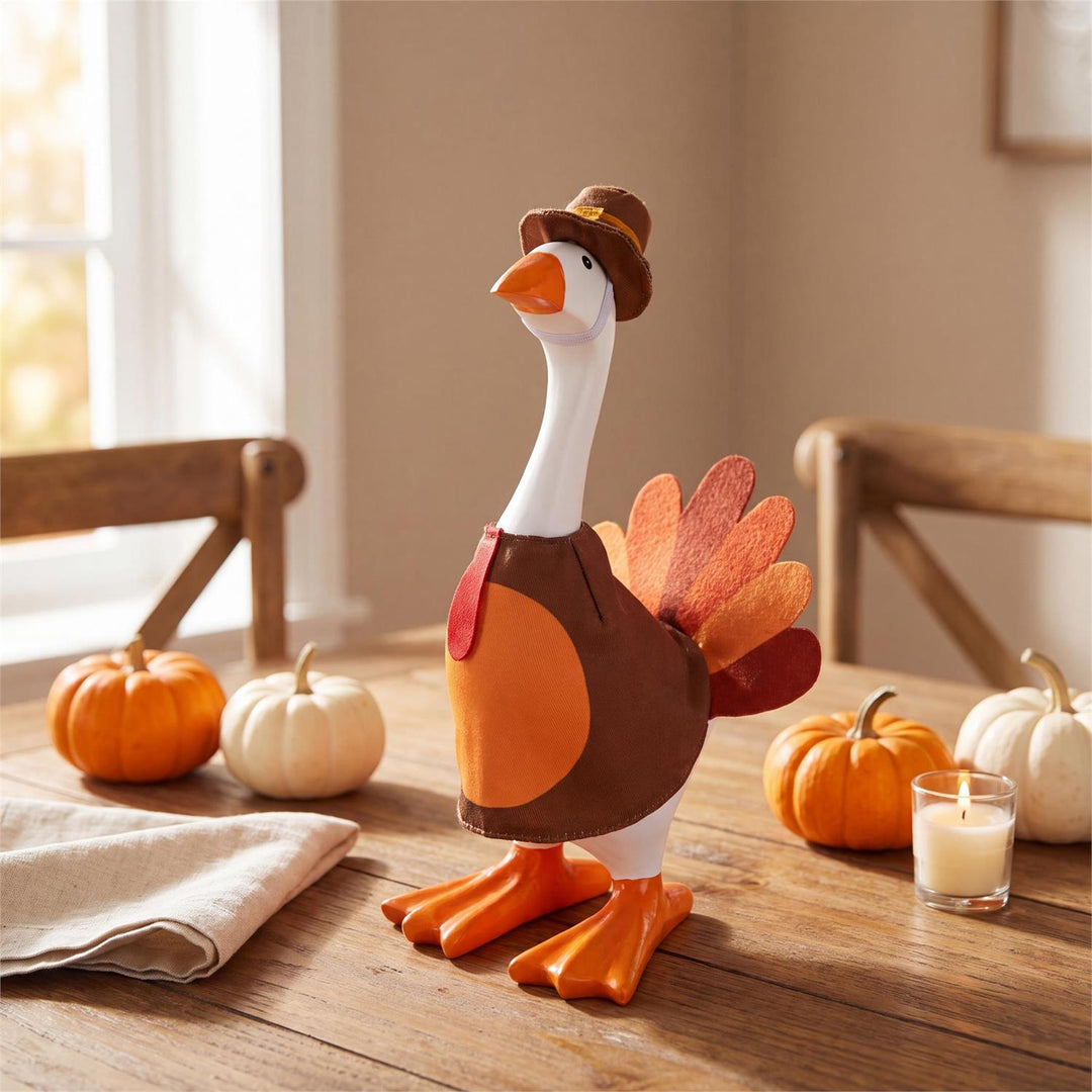 Gordy 8-inch table goose modeling a turkey outfit with colorful tail and brown pilgrim-style hat