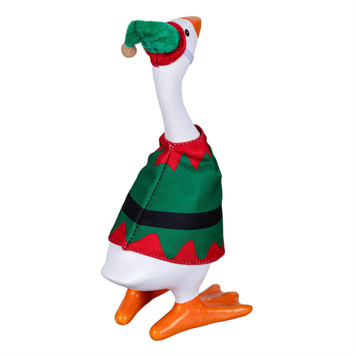 Gordy modeling the Christmas elf outfit in a tabletop display with holiday greenery and miniature gifts