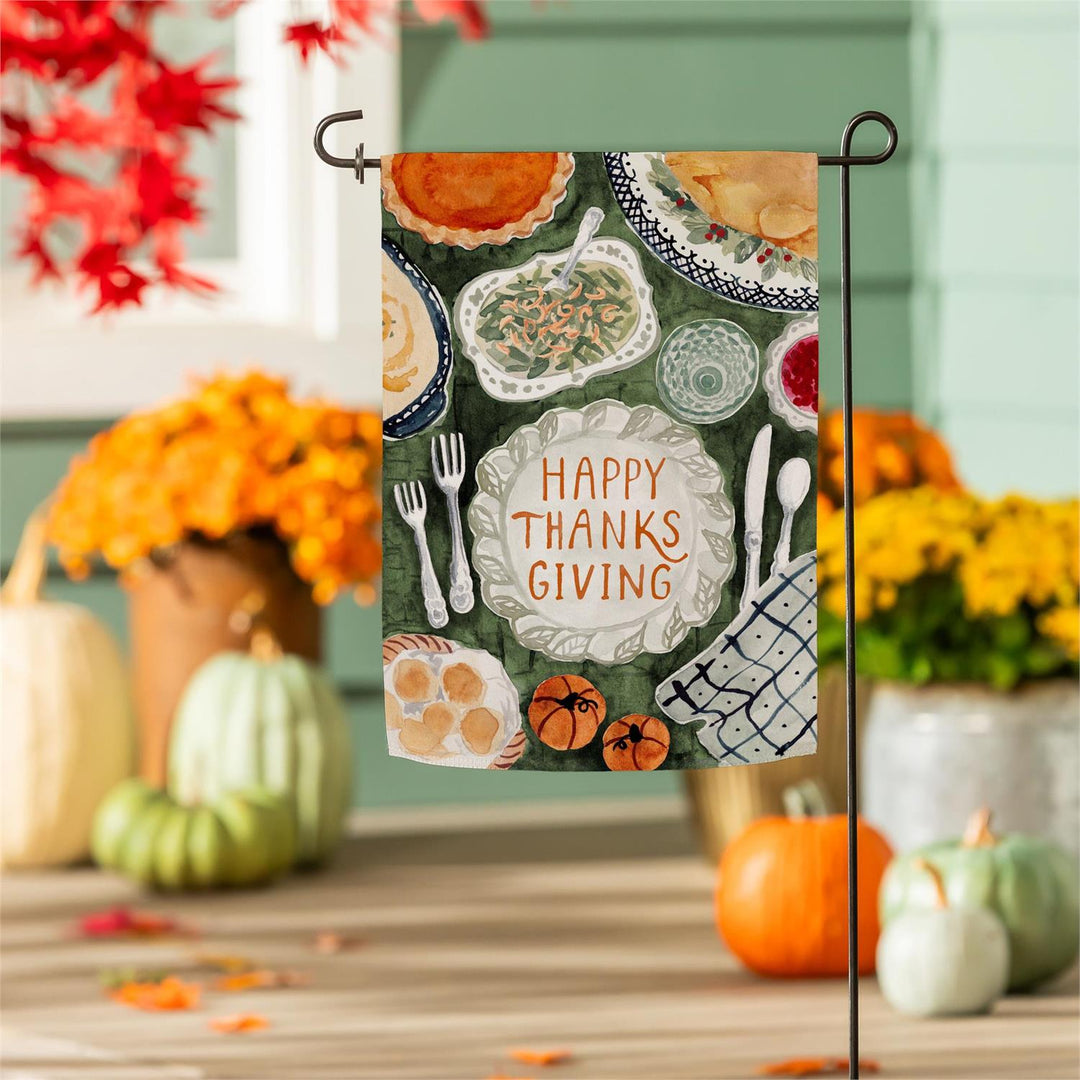 Thanksgiving Spread flag specifications showing single-layer polyester brushed twill and approximately 2-inch pole sleeve