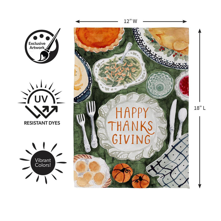 Thanksgiving Spread garden flag displayed on decorative stand beside fall pumpkins