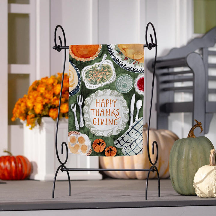 Thanksgiving Spread garden flag with Happy Thanksgiving plate, turkey, pie and pumpkins on green background