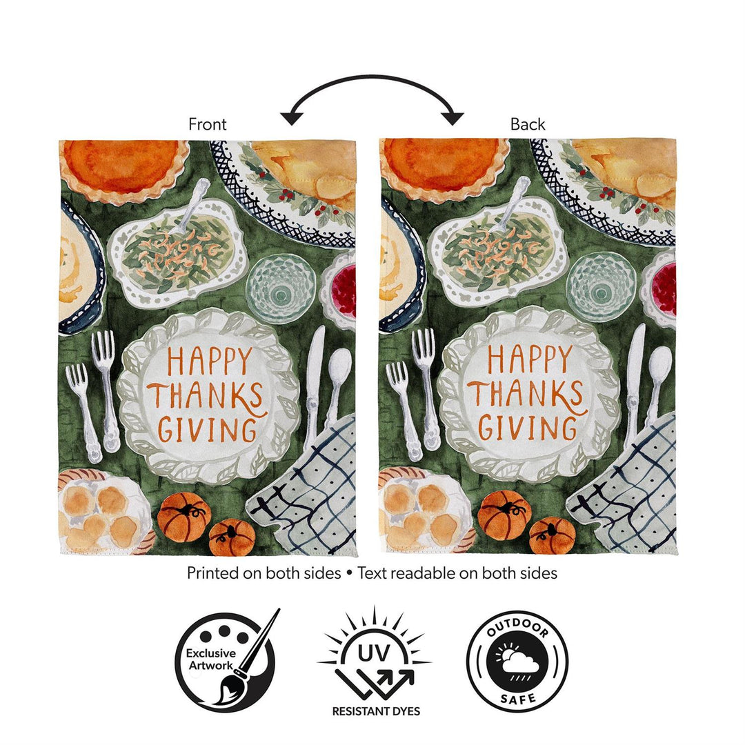 Happy Thanksgiving two-sided garden flag displayed beside autumn flowers and pumpkins