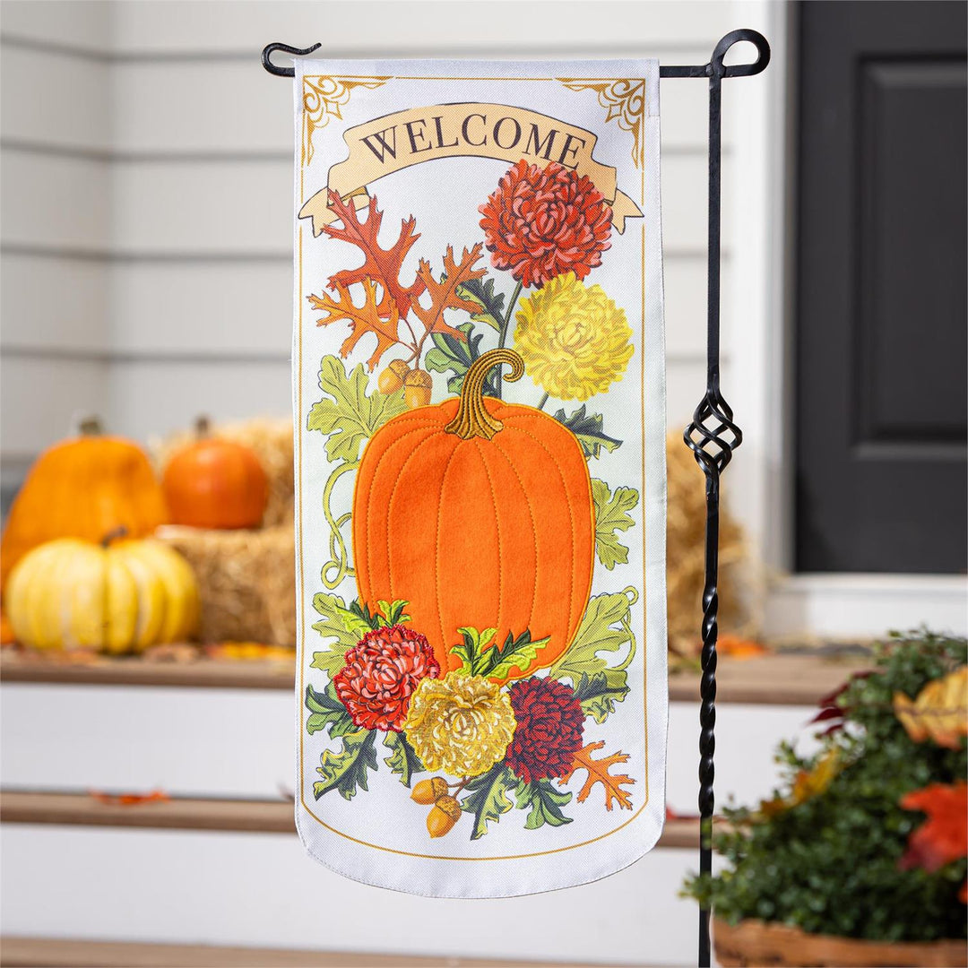 Vintage Welcome Autumn 2 Sided Long Garden Flag hanging on stand with pumpkins and hay bales