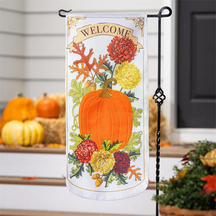 Vintage Welcome Autumn 2 Sided Long Garden Flag hanging on stand with pumpkins and hay bales