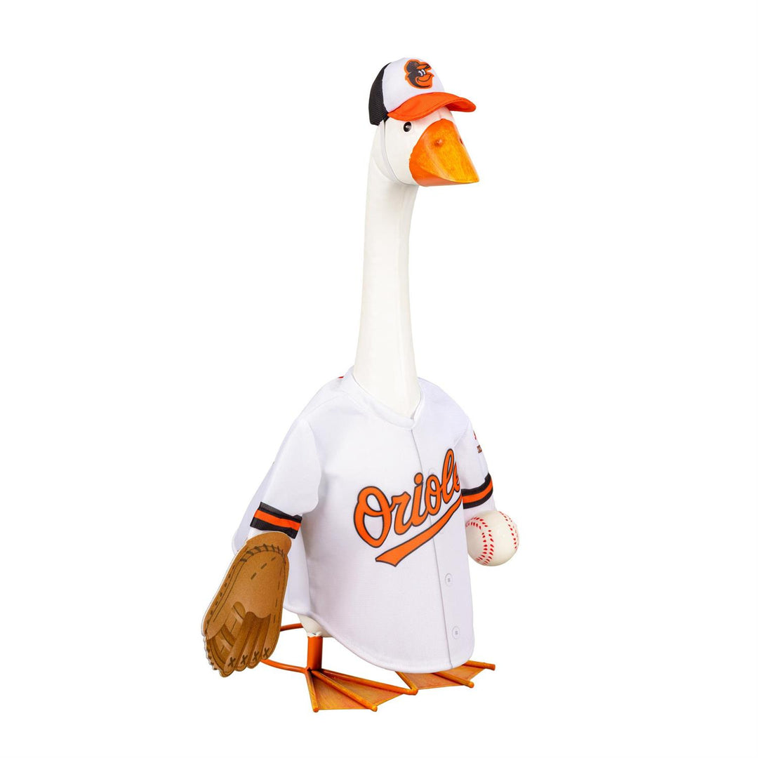 Porch goose modeling Baltimore Orioles jersey and bird-logo cap beside potted flowers