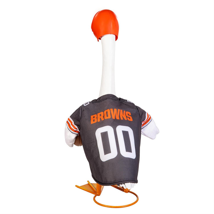 Cleveland Browns football outfit modeled on a decorative porch goose beside a pumpkin; goose not included