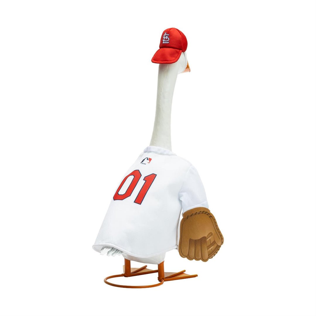 Porch goose modeling St. Louis Cardinals baseball outfit beside a flower planter