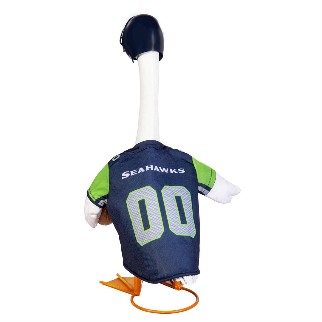 Porch goose modeling Seattle Seahawks jersey and helmet on a fall porch