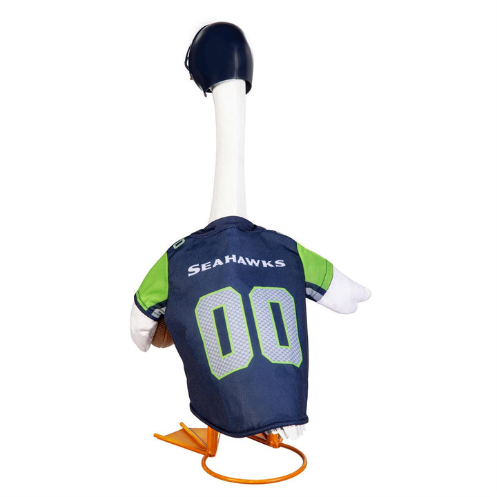 Porch goose modeling Seattle Seahawks jersey and helmet on a fall porch