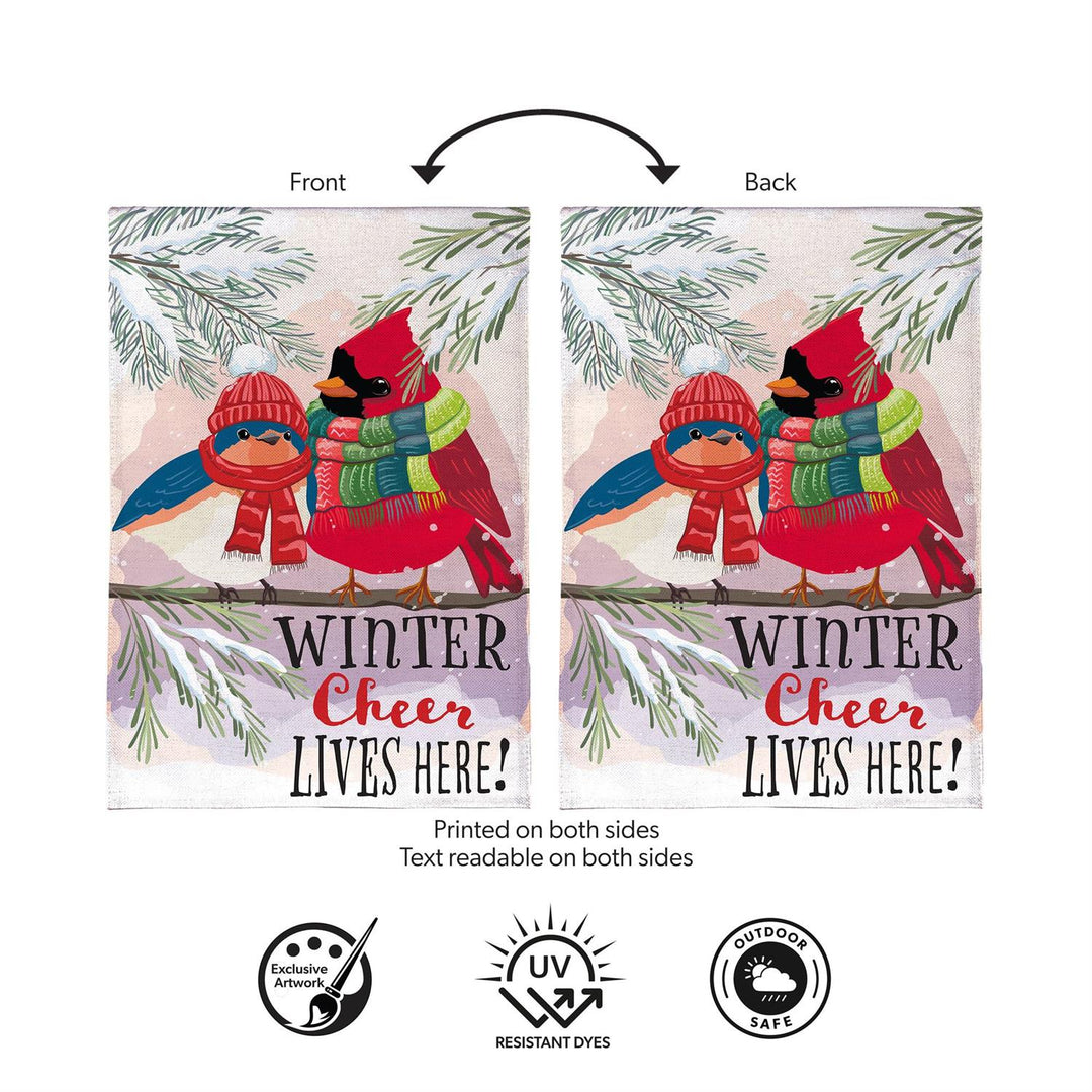 Winter bird garden flag displayed beside a red front door and seasonal greenery
