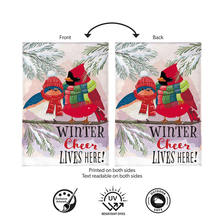Winter bird garden flag displayed beside a red front door and seasonal greenery