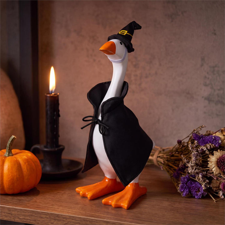Side view of witch outfit displayed on an 8-inch table goose, goose not included