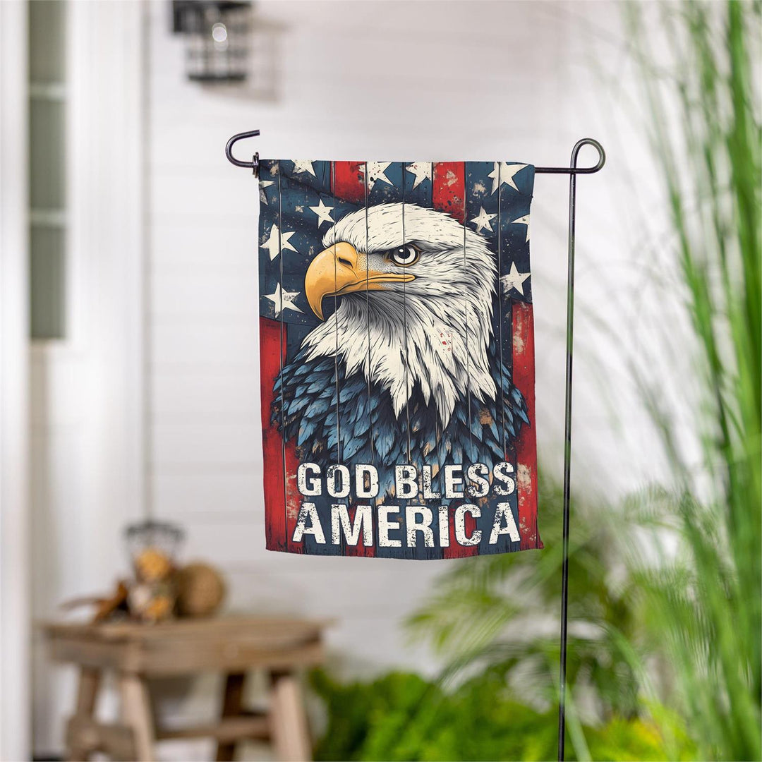God Bless America Eagle 2 Sided Garden Flag displayed on outdoor garden stand